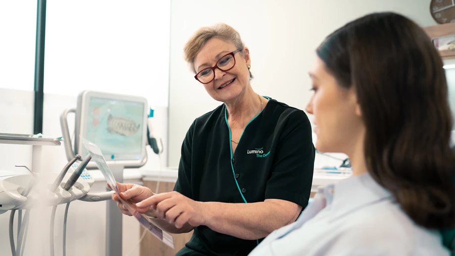 Dentist showing the patient her X-ray results