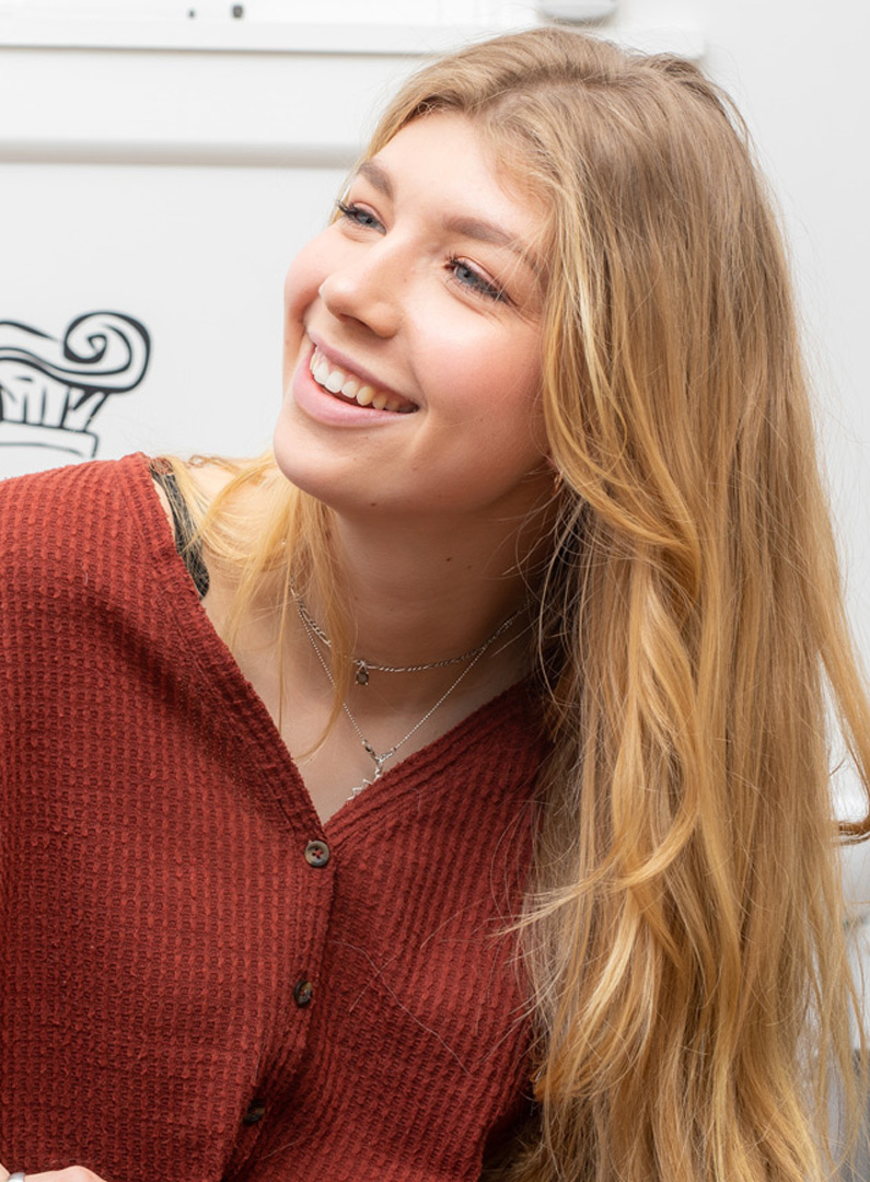 Woman smiling in a red dress 